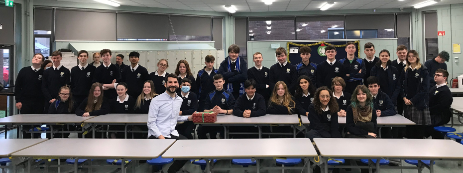 Students from Terenure Presentation College sit with a member of staff from Dublin Simon. They are handing over vouchers for the rough sleepers of Dublin City.